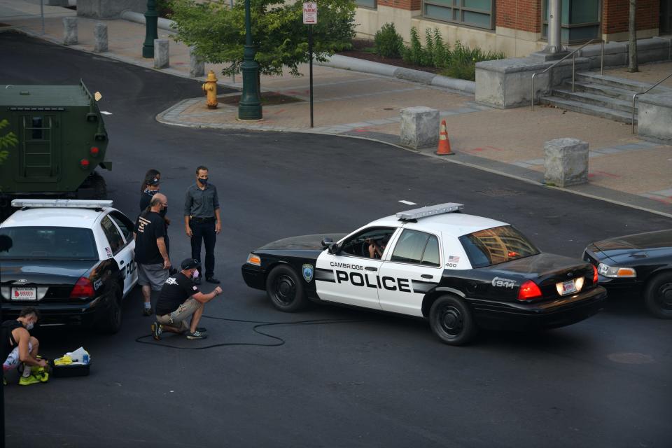 Cambridge police cruisers in Worcester during filming for "Black Panther: Wakanda Forever" in August 2021.