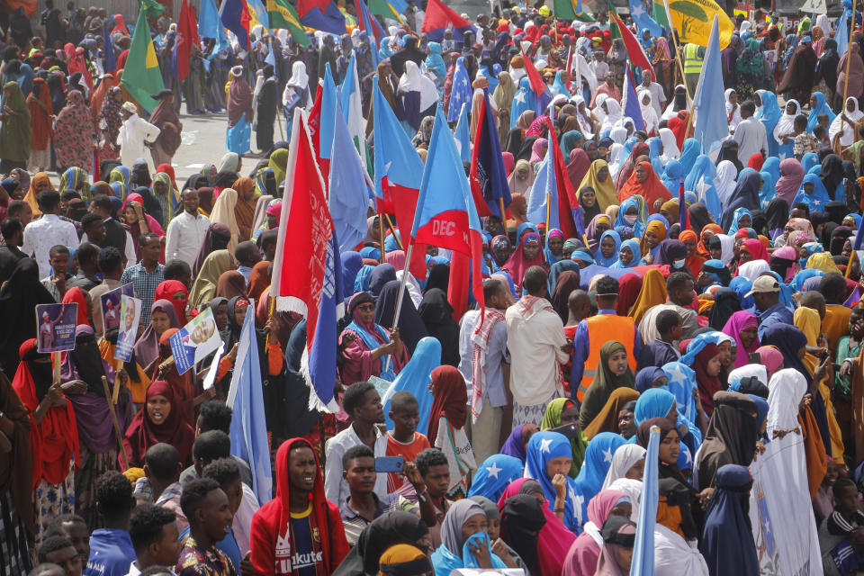 Residents and officials lead a demonstration supporting a resolution to allocate 13 seats to the Banadir region which encompasses the capital, in effect expanding the Senate, in Mogadishu, Somalia Friday, Jan. 29, 2021. As Somalia marks three decades since a dictator fell and chaos engulfed the country, the government is set to hold a troubled national election but two regional states are refusing to take part in the vote to elect Somalia's president and time is running out before the Feb. 8 date on which mandates expire. (AP Photo/Farah Abdi Warsameh)