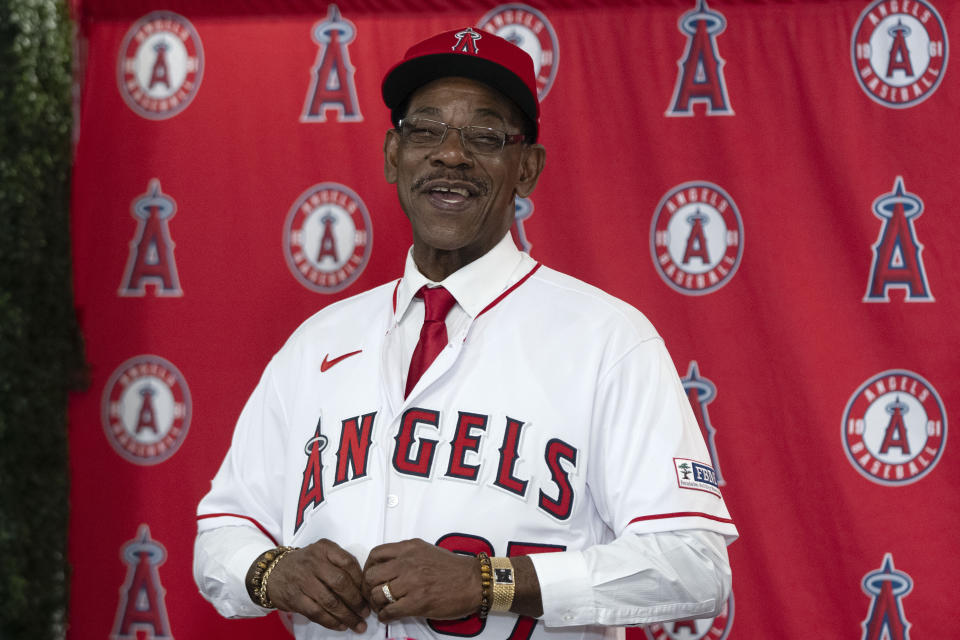 Ron Washington, the new manager of the Los Angeles Angels, puts on his jersey during a news conference Wednesday, Nov. 15, 2023, in Anaheim, Calif. The 71-year-old Washington managed the Texas Rangers from 2007-14, winning two AL pennants and going 664–611. (AP Photo/Jae C. Hong)