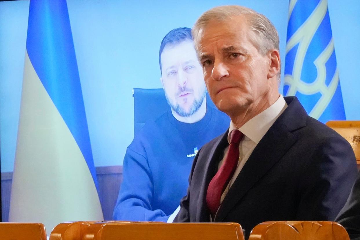 Norways Prime Minister Jonas Gahr Støre, presents the political agreement on the Ukraine program, with Ukrainian President Volodymyr Zelenskyy participation via video link, at the Norwegian parliament, in Oslo (Terje Pedersen / NTB)