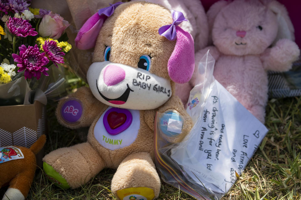 Tributes are seen at a house on Logan Reserve Road, Waterford West in Brisbane.