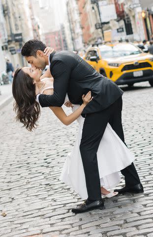 <p>Lesly Junieth/Â©LeslyJunieth</p> Malia Makaila and Jonathan Gandhi kiss during engagement photos.