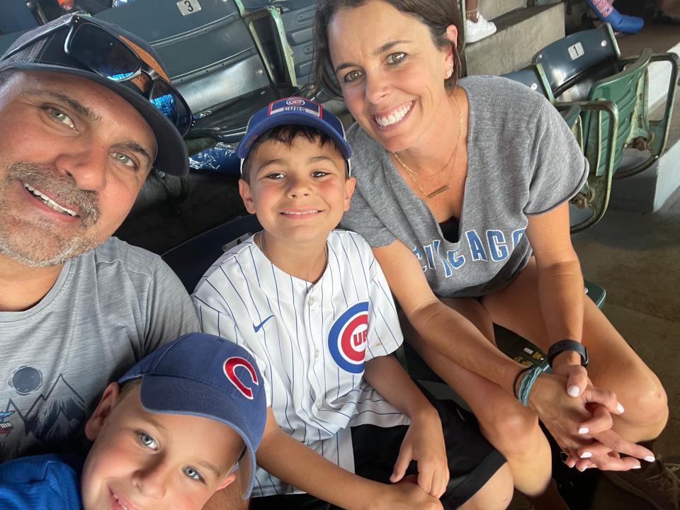 Bo Boroski with his two sons and wife, Katie, at Wrigley Field.