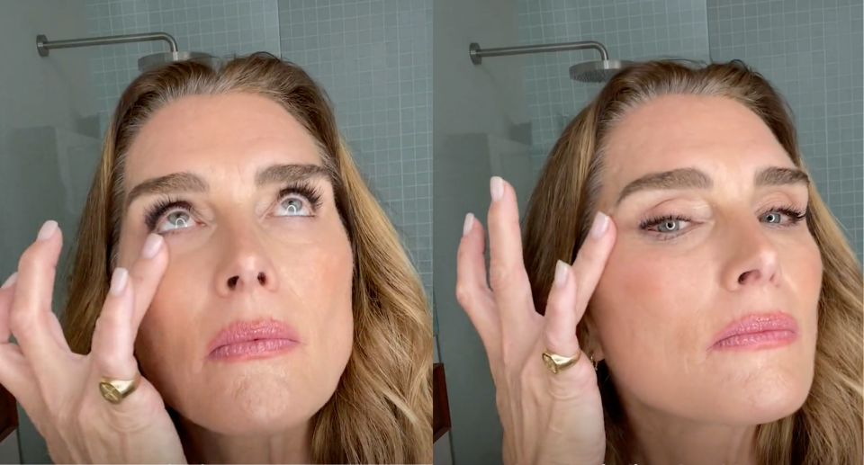 split screen on Brooke Shields applying True Botanicals' Resurrection Radiance Eye Cream in bathroom (photo via True Botanicals)
