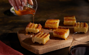 Queijo Assado is grilled Brazilian cheese served straight from the churrasco grill with Malagueta honey and is now available to order on the Bar Fogo menu. Fogo.com