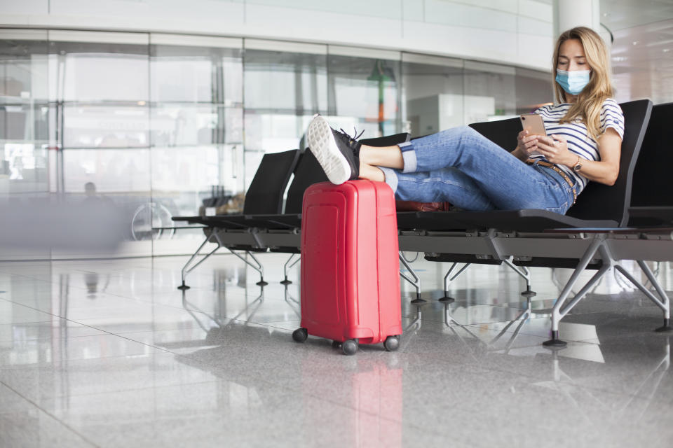 woman in airport with face mask