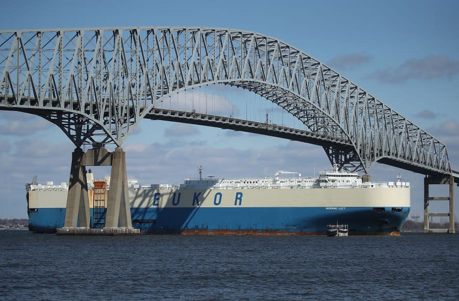 An outbound cargo ship passes under the Francis Scott Key Bridge, March 9, 2018 in Baltimore, Maryland. (Photo by Mark Wilson/Getty Images)