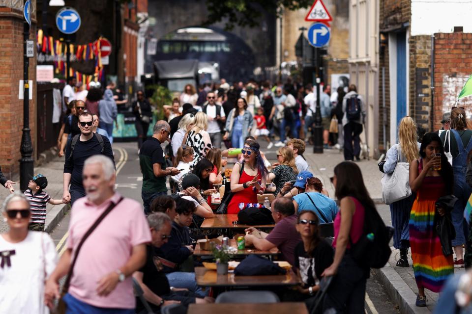 People take part in a community street party in Borough, London (REUTERS)