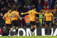 Wolverhampton Wanderers' Raul Jimenez celebrates scoring his side's third goal with teammates of the game during the English Premier League soccer match between Southampton and Wolverhampton Wanderers at the St Mary’s stadium, Southampton, England. Saturday, Jan. 18, 2020. (Mark Kerton/PA via AP)