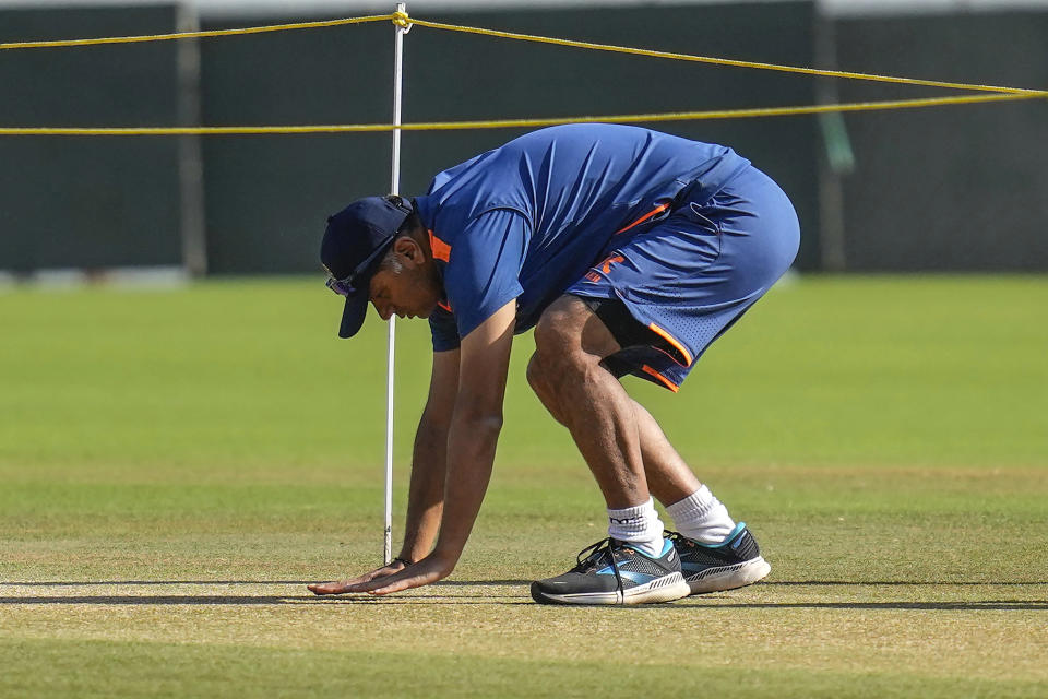 Indian cricket team head coach Rahul Dravid inspects the pitch ahead of the first cricket test match between India and Australia, in Nagpur, India, Wednesday, Feb. 8, 2023. (AP Photo/Rafiq Maqbool)