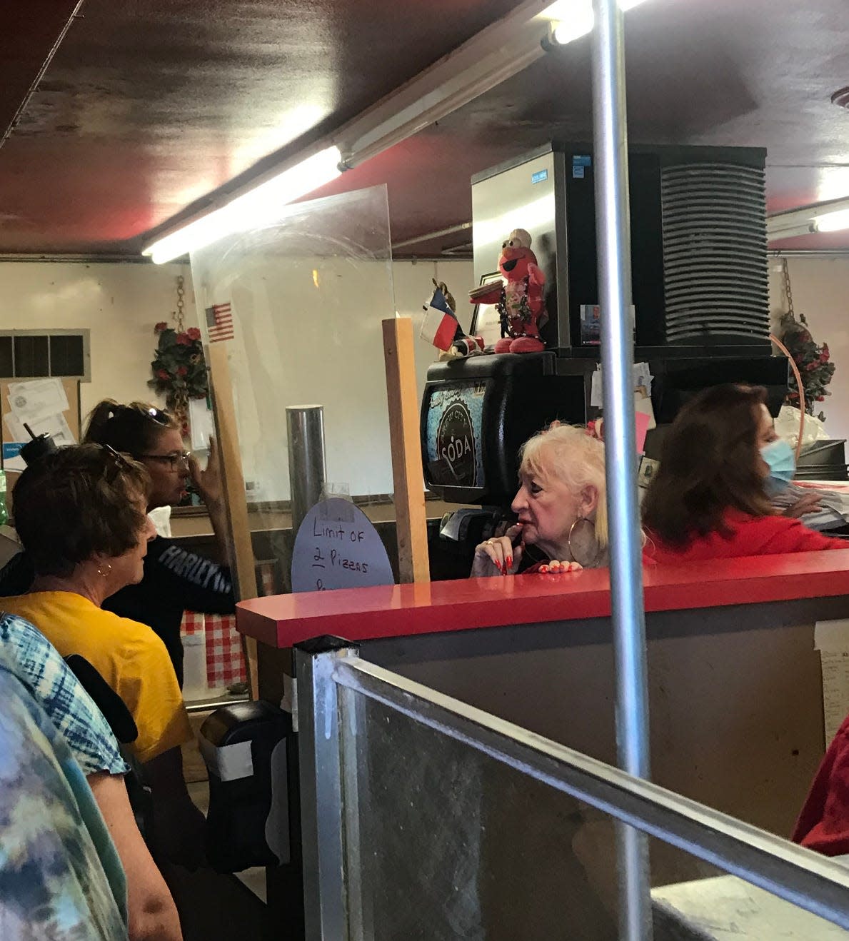 Bonnie Crivello speaks with a customer Sunday at Maria's Pizza, 5025 W. Forest Home Ave. The founding family was closing the restaurant Sunday but in talks with a potential buyer to continue the operation.