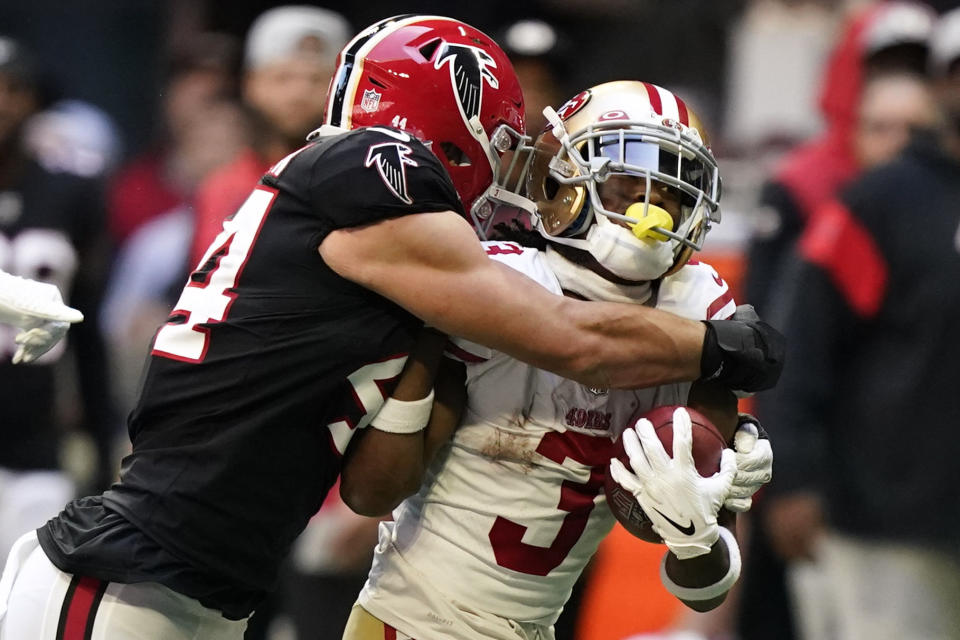 San Francisco 49ers wide receiver Ray-Ray McCloud III (3) is wrapped up by Atlanta Falcons linebacker Troy Andersen (44) during the first half of an NFL football game, Sunday, Oct. 16, 2022, in Atlanta. (AP Photo/Brynn Anderson)