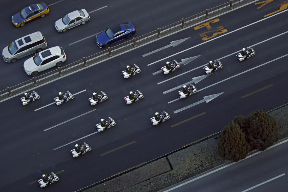 Chinese paramilitary policemen on motorcycles escort a motorcade believed to be carrying North Korean leader Kim Jong Un traveling past Chang'an Avenue in Beijing, Wednesday, Jan. 9, 2019. North Korean state media reported Tuesday that Kim is making a four-day trip to China in what's likely an effort by him to coordinate with his only major ally ahead of a summit with U.S. President Donald Trump that could happen early this year. (AP Photo/Andy Wong)