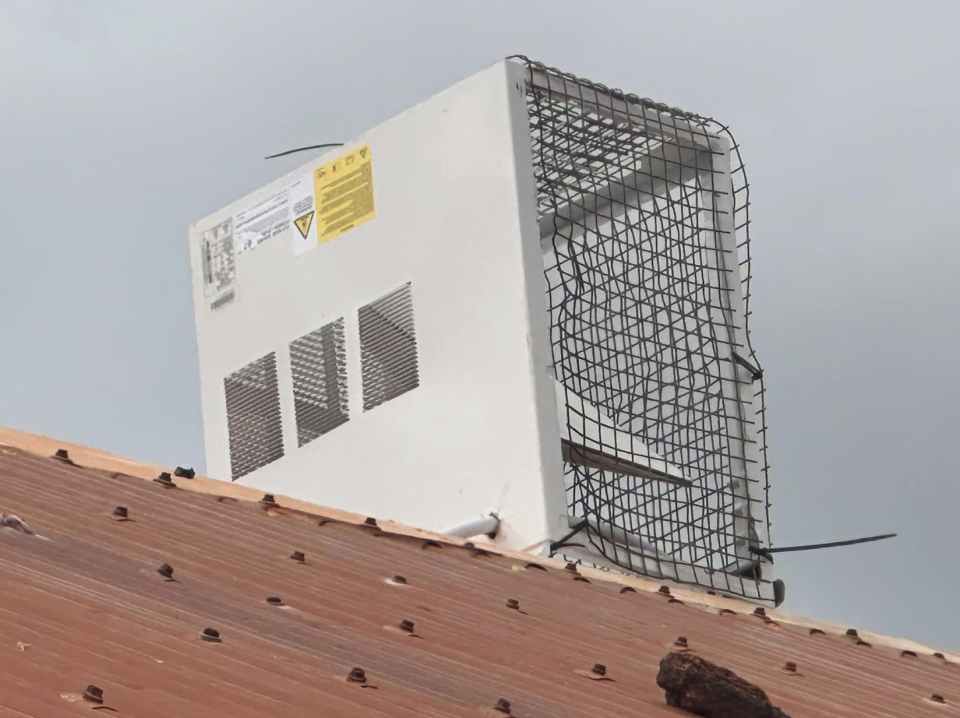 A close-up of the contraption on the roof, showing the mesh attached with zip ties.