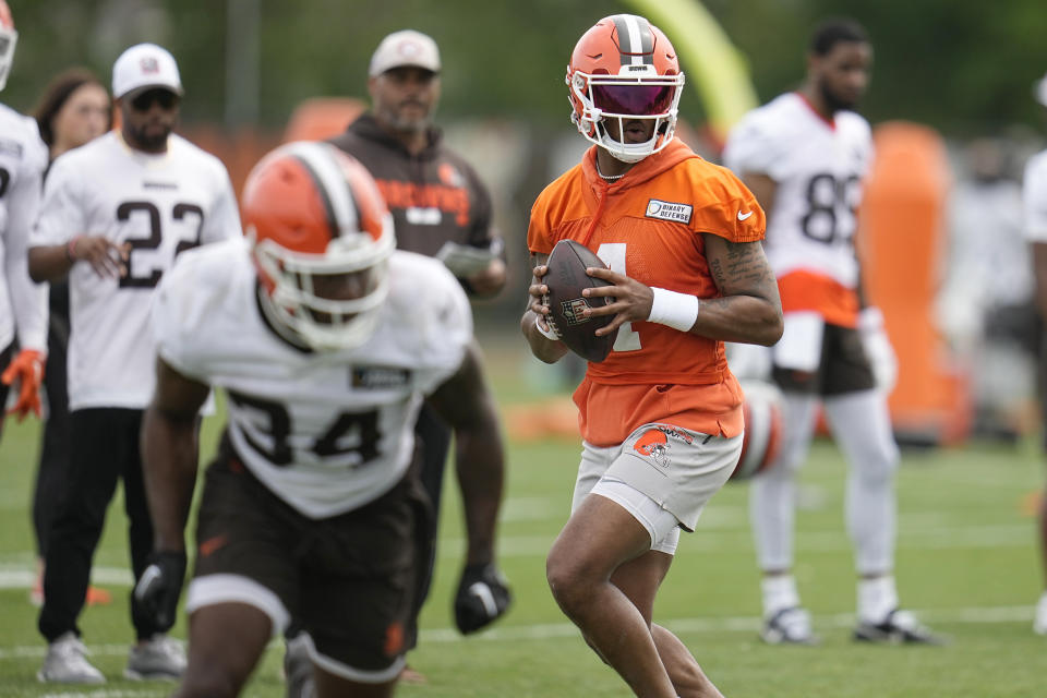 Cleveland Browns quarterback Deshaun Watson participates in a drill during NFL football practice in Berea, Ohio, Wednesday, May 22, 2024. He took part in most of the drills on the second day of organized team activities (OTAs) but didn't do any passing. (AP Photo/Sue Ogrocki)