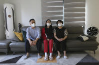 Ma Seo-bin, center, a high school senior at an elite, speaks in between her father Ma Moon Young, left, and mother Choi Hae-jeong during an interview at their home in Siheung, South Korea, on Sept. 19, 2020. “I felt I was trapped at the same place and I got lots of psychological stress,” said daughter Ma. When South Korea began its delayed school year with remote learning in April, that spelled trouble for low-income students who rely on public education, get easily distracted and cannot afford private schools or tutors used by many in this education-obsessed country. (AP Photo/Ahn Young-joon)