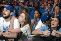 Kansas City Royals fans react to their team's loss at baseball's World Series against the San Francisco Giants, during a watch party at The Kansas City Power & Light District in Kansas City, Missouri, October 29, 2014. REUTERS/Sait Serkan Gurbuz (UNITED STATES - Tags: SPORT BASEBALL)