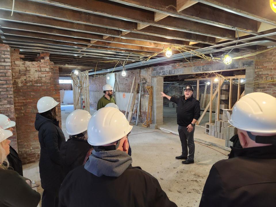 C.L. Real Estate Development’s VP of Construction and Development Nick Fox explains the scope of work in the basement of the historic Keefer House Hotel.