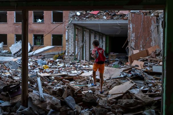 PHOTO: FILE - Ivan Hubenko, 11, walks on the rubble of his former Chernihiv School #21, which was bombed by Russian forces on March 3, in Chernihiv, Ukraine, Tuesday, Aug. 30, 2022. (Emilio Morenatti/AP)