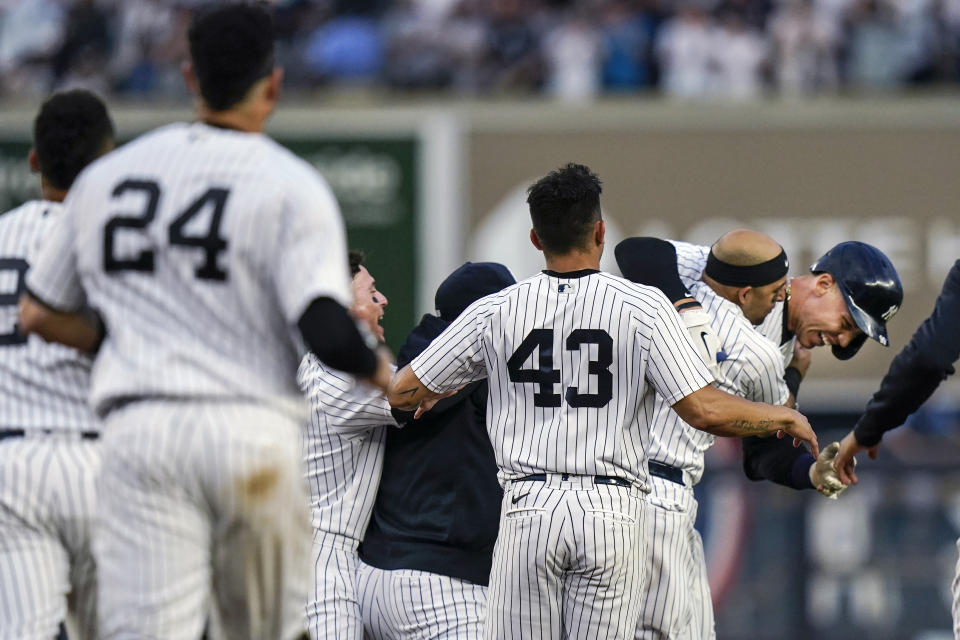 New York Yankees' Aaron Judge, right, celebrates with teammates after a baseball game against the Tampa Bay Rays Sunday, Oct. 3, 2021, in New York. The Yankees won 1-0. (AP Photo/Frank Franklin II)