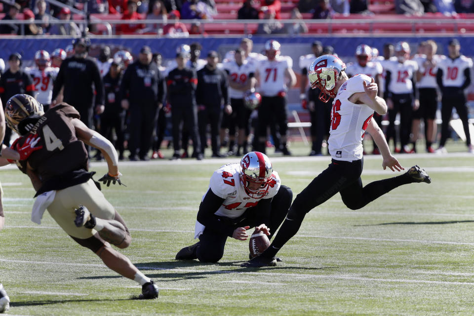 Western Kentucky place kicker Cory Munson, right, kicks a field goal from the hold of John Haggerty (47) while Western Michigan cornerback Patrick Lupro (4) applies pressure during the first half of the NCAA First Responder Bowl college football game in Dallas, Monday, Dec. 30, 2019. (AP Photo/Roger Steinman)