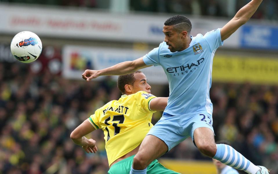 Gael Clichy wins a header against Norwich