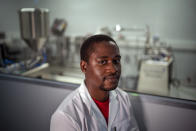 Donald Mjonono, an engineer at Afrigen Biologics and Vaccines ​in Cape Town, South Africa, poses for a photograph Tuesday, Oct. 19, 2021. In a pair of warehouses converted into labs, a team of Afrigen scientists is assembling the equipment needed to reverse engineer Moderna's coronavirus vaccine. The scientists are effectively making an end run around an industry that has vastly prioritized rich countries over poor in vaccine sales and manufacturing. ​(AP Photo/Jerome Delay)