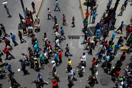 Demonstrators march along a street during a protest in Port-au-Prince, Haiti, July 14, 2018. REUTERS/Andres Martinez Casares