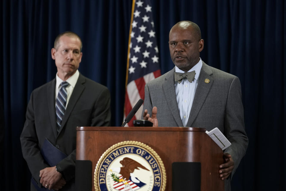 U.S. Attorney for the Northern District of California Ismail J. Ramsey, right, speaks to reporters during a press conference to announce federal authorities have charged 10 current and former Northern California police officers in a corruption investigation Thursday, Aug. 17, 2023, in San Francisco. Arrest warrants were served Thursday in California, Texas and Hawaii. (AP Photo/Godofredo A. Vásquez)