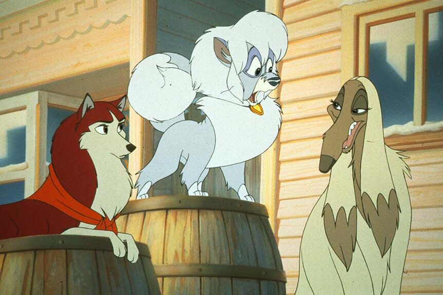 Jenna (Bridget Fonda) and Sylvie, standing on a barrel, listen to Dixie (Sandra Dickinson) speak outside in Balto (1995).