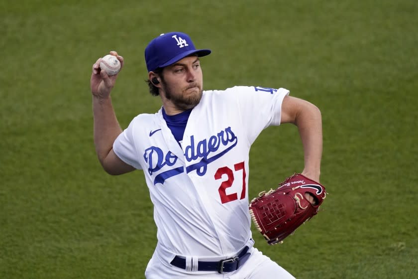 Los Angeles Dodgers starting pitcher Trevor Bauer warms up prior to a baseball game against the Colorado Rockies.