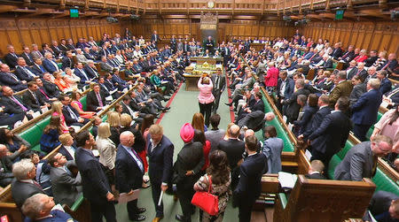 Members of Parliament for the Scottish National Party (SNP) walk out of the House of Commons during Prime Minister's Questions after their leader Ian Blackford was asked to leave by the Speaker, in London, Britain, June 13, 2018. Parliament TV handout via REUTERS