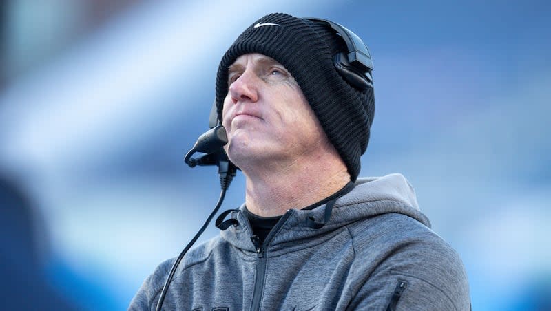 Utah State head coach Blake Anderson looks up a the videoboard late in second half of the Famous Idaho Potato Bowl NCAA college football game against Georgia State, Saturday, Dec. 23, 2023, in Boise, Idaho. (AP Photo/Steve Conner)