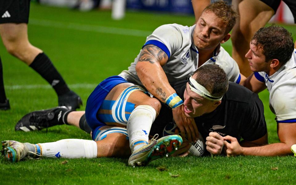 Lock Brodie Retallick, centre, crashes over the line