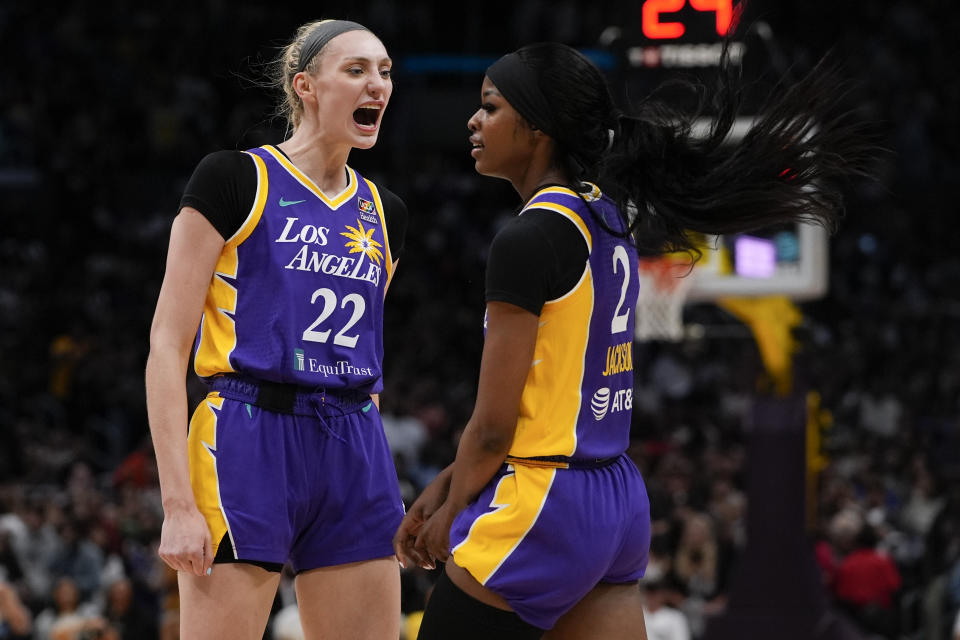 Los Angeles Sparks forward Cameron Brink, left, reacts after forward Rickea Jackson drew a foul during the first half of a WNBA basketball game against the Las Vegas Aces, Sunday, June 9, 2024, in Los Angeles. (AP Photo/Ryan Sun)