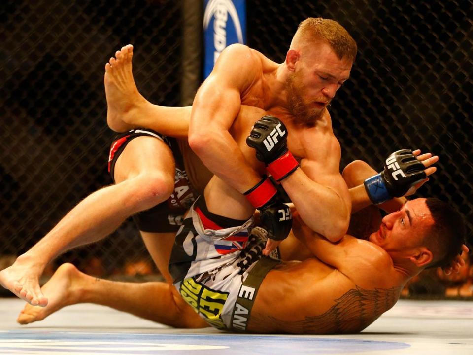 McGregor fighting Holloway at UFC Boston in August 2013 (Getty)