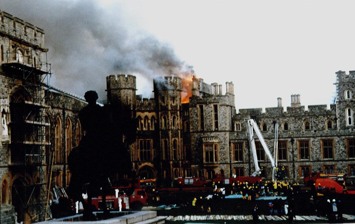 FIRE AT WINDSOR CASTLE - Firemen fighting against fire.