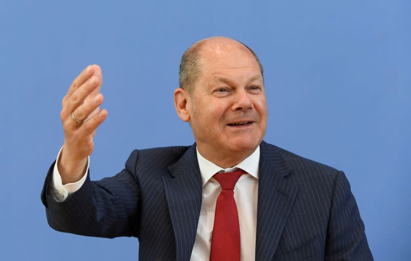 FILE PHOTO: German Finance Minister Olaf Scholz attends a news conference in Berlin