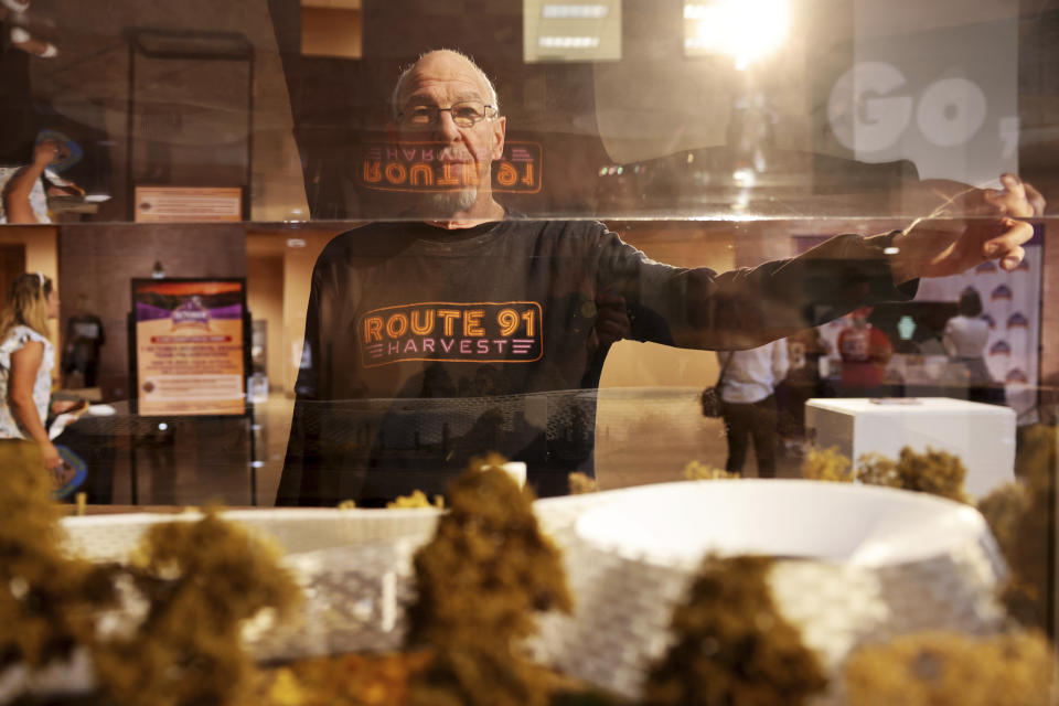 Joseph Kocjan, a security guard who worked the night of the Route 91 Harvest festival shooting, with a model by 1 October Memorial finalist Aaron Neubert Architects+studioSTIGSGAARD on display in the rotunda at the Clark County Government Center in Las Vegas, Monday, June 5, 2023. (K.M. Cannon/Las Vegas Review-Journal via AP)