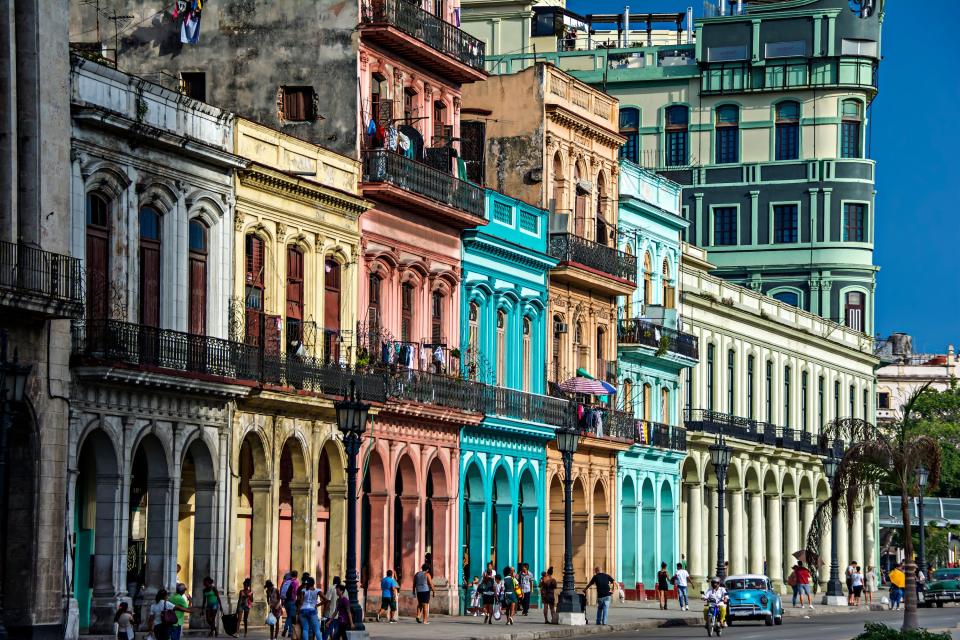 No matter where you stand politically, everyone can agree Cuba's architecture is stunningly beautiful. With historic buildings painted in unmistakable palettes of cobalt blue, banana yellow, and sun-bleached pinks, tourists from around the world have flocked to this tropical locale. For those looking to capture the best examples of awe-inspiring architecture on the island nation, look no further than the streets surrounding Havana's Parque Central (or Central Park). It's there that pedestrians can leisurely stroll past historic colonial buildings with arches and balconies painted in a bevy of bright colors.