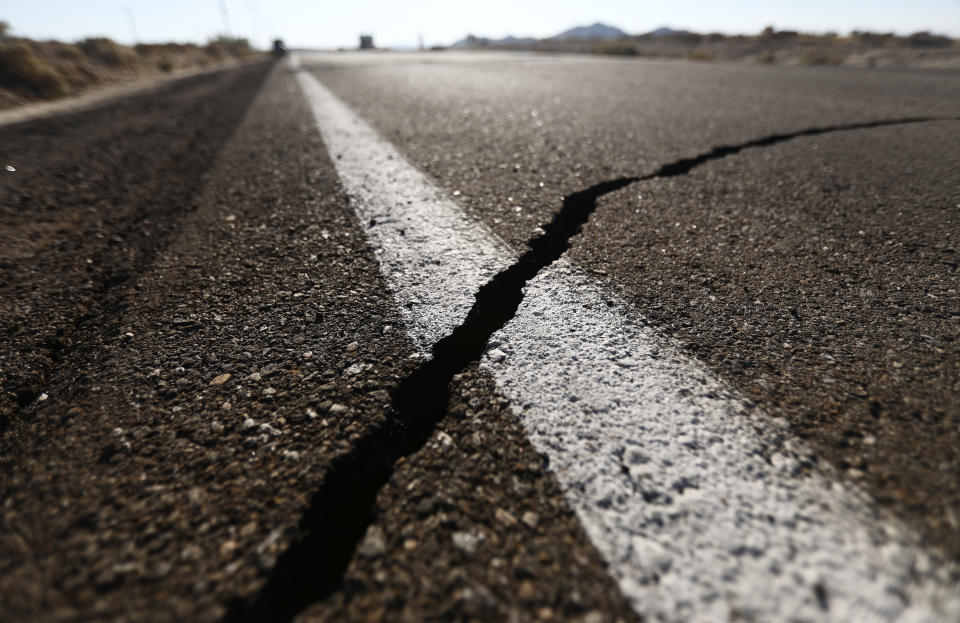 RIDGECREST, CALIFORNIA - JULY 04:  A crack stretches across the road after a 6.4 magnitude earthquake struck the area on July 4, 2019 near Ridgecrest, California. The earthquake was the largest to strike Southern California in 20 years with the epicenter located in a remote area of the Mojave Desert. The temblor was felt by residents across much of Southern California. (Photo by Mario Tama/Getty Images)