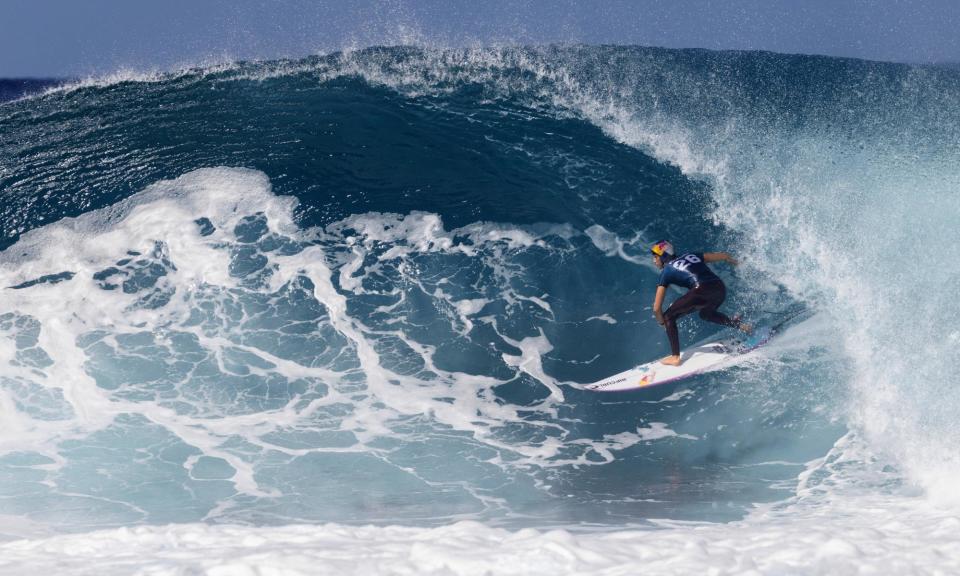<span>Making waves: Australia’s Molly Picklum competes in the World Surf League event at Banzai Pipeline.</span><span>Photograph: Brian Bielmann/AFP/Getty Images</span>