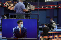 Preparations take place for the first Presidential debate in the Sheila and Eric Samson Pavilion, Monday, Sept. 28, 2020, in Cleveland. The first debate between President Donald Trump and Democratic presidential candidate, former Vice President Joe Biden is scheduled to take place Tuesday, Sept. 29. (AP Photo/Patrick Semansky)