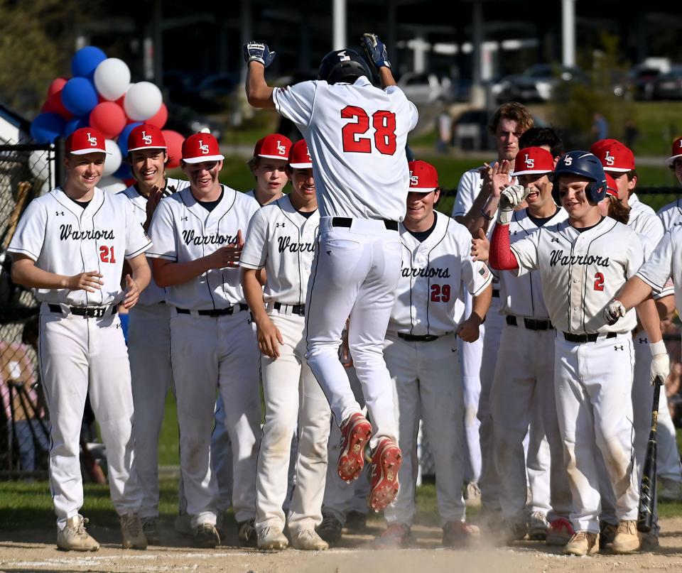 Lincoln-Sudbury's Jake Haarde (28) comes in for a landing at home plate after a solo home run in the second inning against Bedford at Lincoln-Sudbury High School on May 12.