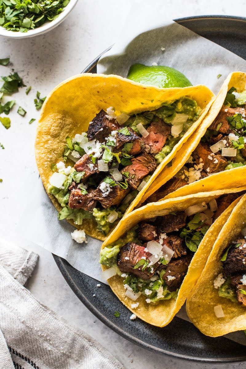 <p>Carne asada—meaning “grilled meat”—is a taco made from thin slices of steak that have been marinated and grilled. Use flank steak or skirt steak and slice it into bite-sized chunks.</p><p><strong>Get the recipe at <a href="https://www.isabeleats.com/carne-asada-tacos/" rel="nofollow noopener" target="_blank" data-ylk="slk:Isabel Eats;elm:context_link;itc:0;sec:content-canvas" class="link ">Isabel Eats</a>.</strong></p><p><strong><a class="link " href="https://go.redirectingat.com?id=74968X1596630&url=https%3A%2F%2Fwww.walmart.com%2Fsearch%2F%3Fquery%3Dcutting%2Bboard&sref=https%3A%2F%2Fwww.thepioneerwoman.com%2Ffood-cooking%2Fmeals-menus%2Fg36008054%2Ftypes-of-tacos%2F" rel="nofollow noopener" target="_blank" data-ylk="slk:SHOP CUTTING BOARDS;elm:context_link;itc:0;sec:content-canvas">SHOP CUTTING BOARDS</a><br></strong></p>