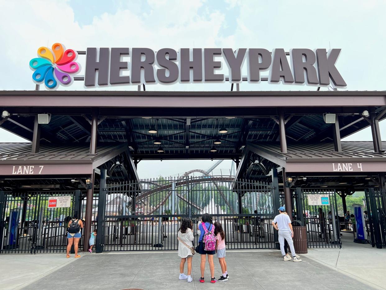 Guest stand outside the gates to Hersheypark. This entrance was unveiled in 2020 as part of the park's new, expanded Hershey's Chocolatetown area.