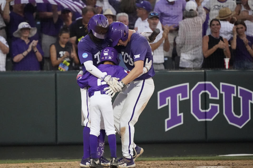 TCU's Cole Fontenelle, right, celebrates after his solo home run with teammate Tre Richardson, left, during the fifth inning of an NCAA college baseball tournament super regional game against Indiana State in Fort Worth, Texas, Saturday, June 10, 2023. (AP Photo/LM Otero)