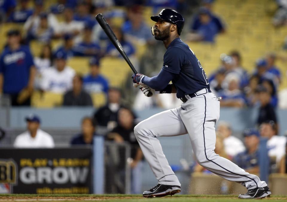 FILE - In this Oct. 6, 2013, file photo, Atlanta Braves' Jason Heyward watches his two-run home run against the Los Angeles Dodgers in the ninth inning of Game 3 of the National League division baseball series in Los Angeles. Heyward and the Braves agreed Tuesday, Feb. 4, 2014, to a $13.3 million, two-year contract that avoided arbitration. (AP Photo/Danny Moloshok, File)