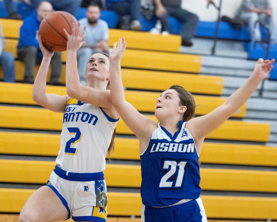 East Canton's Audrey Wade shoots in the first half with pressure from Lisbon David Anderson's Brooklyn Cosins at East Canton Thursday, Feb. 15, 2024.