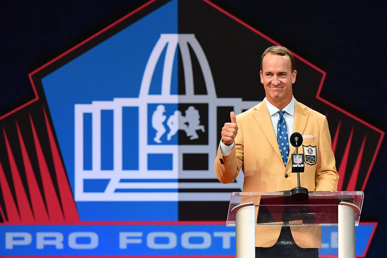 CANTON, OHIO - AUGUST 08: (EDITOR'S NOTE: Retransmission alternate crop) Peyton Manning reacts to the crowd during the NFL Hall of Fame Enshrinement Ceremony at Tom Benson Hall Of Fame Stadium on August 08, 2021 in Canton, Ohio. (Photo by Emilee Chinn/Getty Images)
